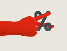 a person holding a pair of scissors in their hand.